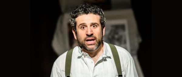 Solomon looking down the cambra in a shocked way