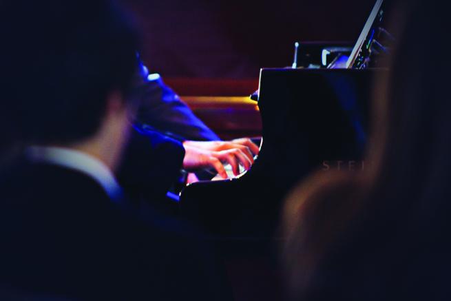 A Competitor playing a keyboard at the Leeds Conservatoire Piano Competition