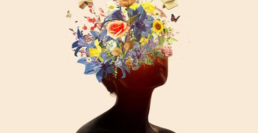 An women's silhouette - the top of her head becomes flowers.