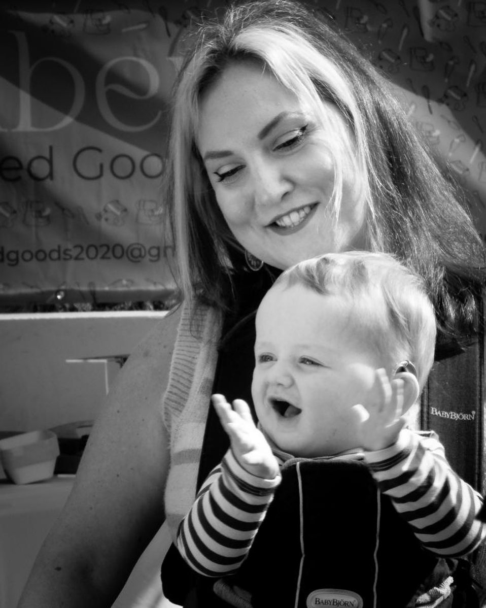 Mother and baby smiling and clapping