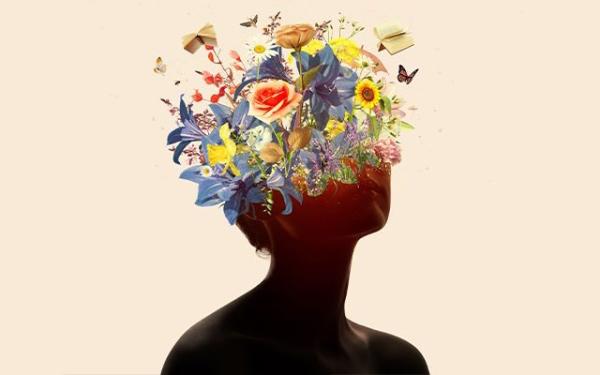 An women's silhouette - the top of her head becomes flowers.