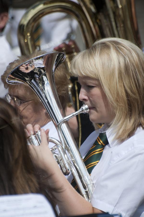 A musician performing on a brass instrument. 