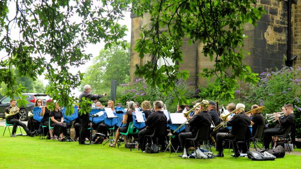 Musicians performing in a park. 