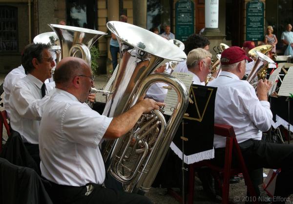 Musicians performing in a brass band. 