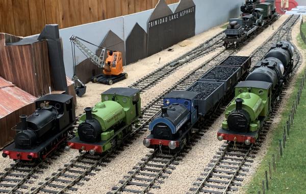 4 model railway engines on tracks