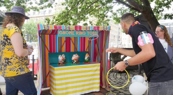 Photo of someone taking a throw at the Gnome Toss game