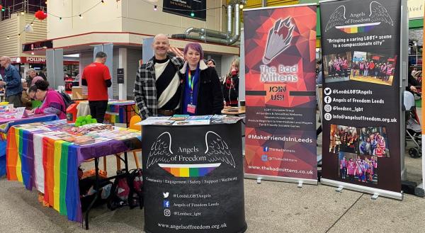 Angels Richard and Bean with branded promo banners