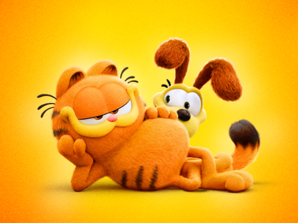 Cartoon orange cat with black stripes and smug expression lying down, and yellow dog with long brown ears peering out from behind it.