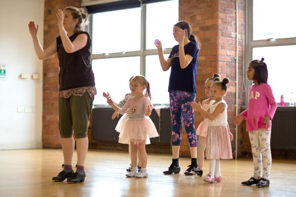 Children and adults dancing