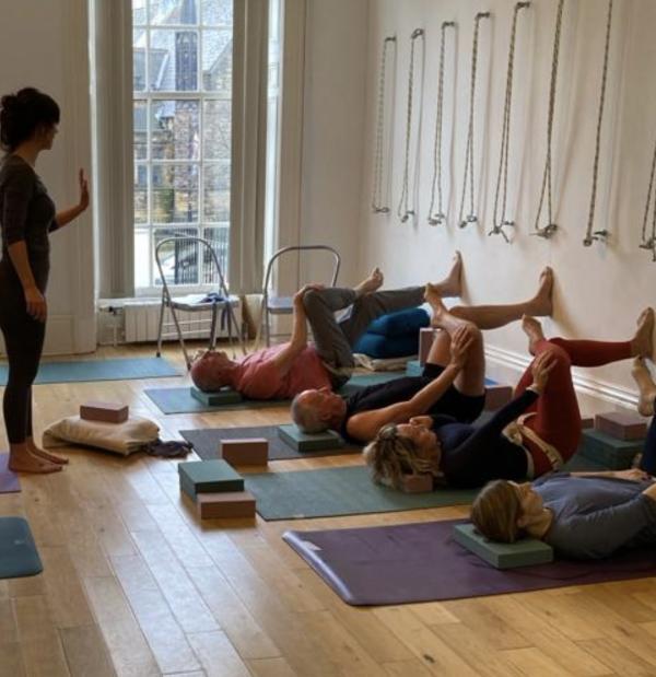 a class being taught at yoga metta