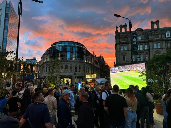 the big screen in city square at night