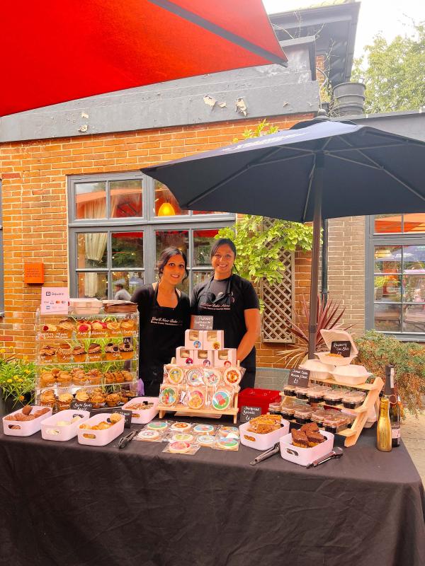 Photo of a previous night market - 2 people with their stall