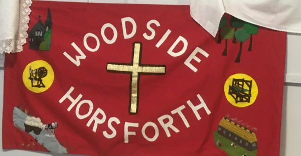Hand made banner from the church with images of the buildings.