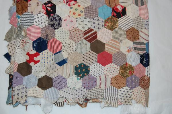 A piece of colourful patchwork in a quilt pattern