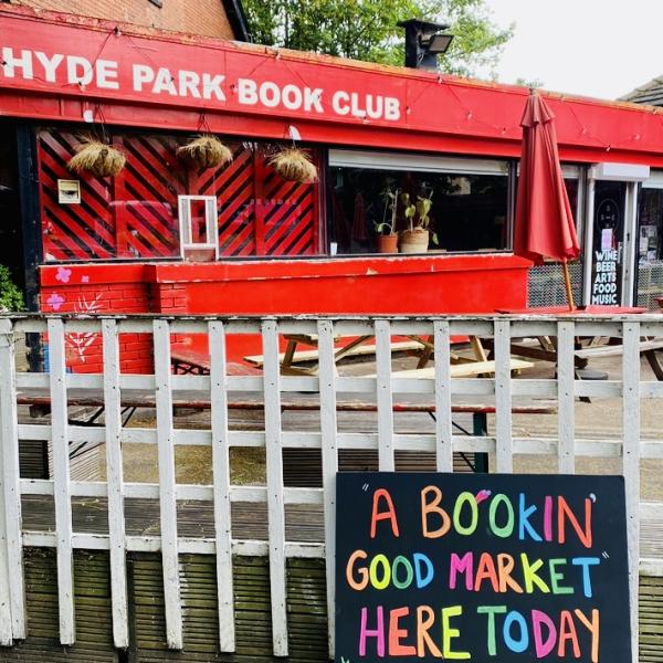 The entrance to Hyde Park Book Club with a sign saying market here today 