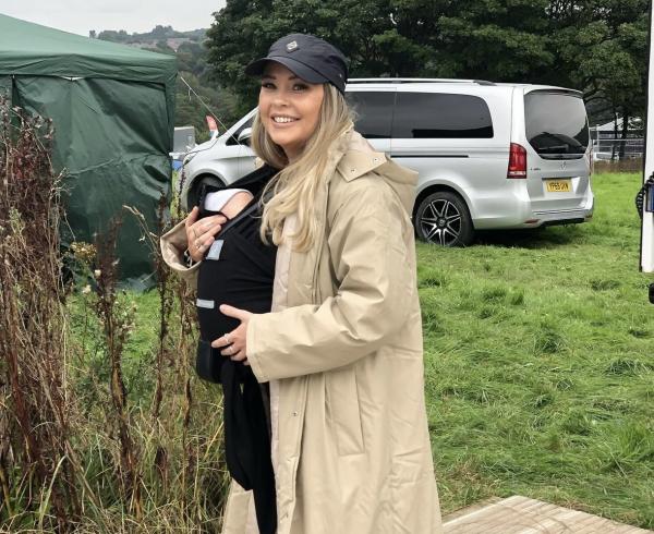 A photo of Vix Wright Jones holding her baby