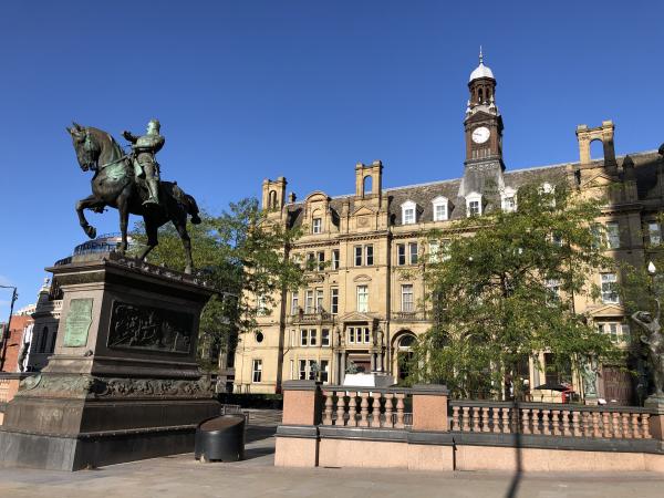 Shows city square, Leeds. Black prince statue, blue skies 