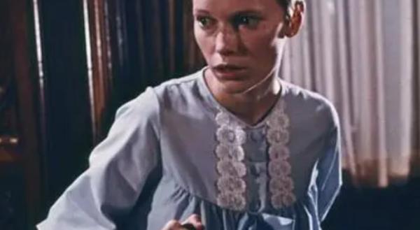 Mia Farrow as Rosemary Woodhouse in a blue nightgown