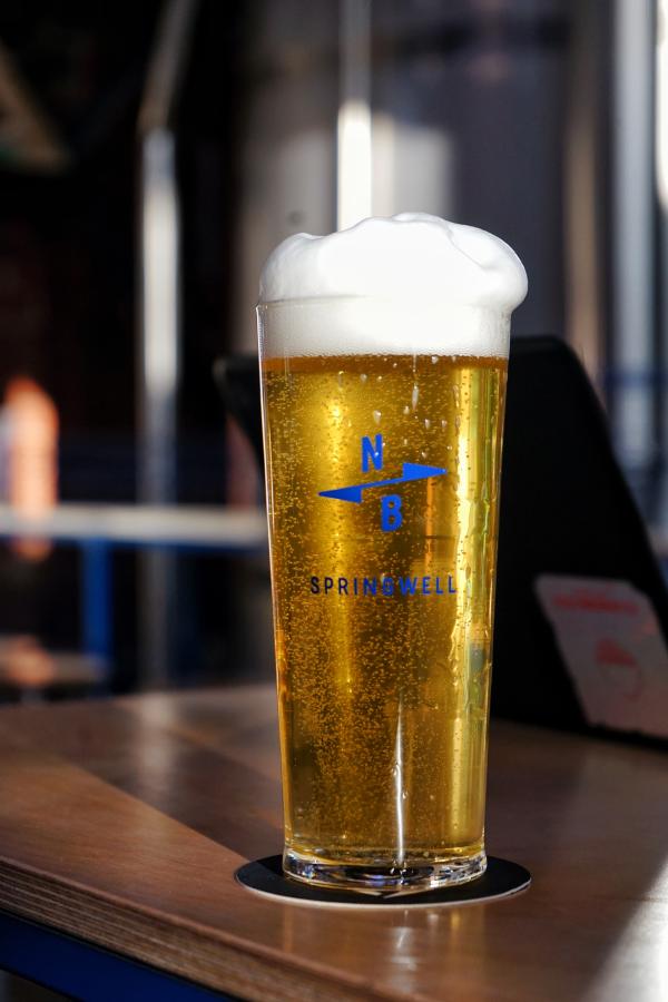 A freshly poured pint of our Springwell Pilsner