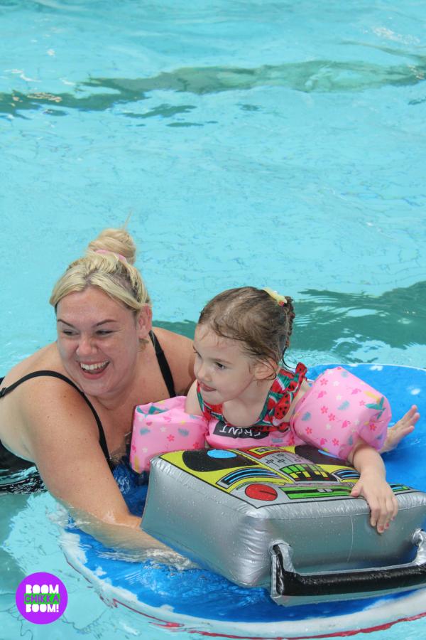 family having fun in swimming pool