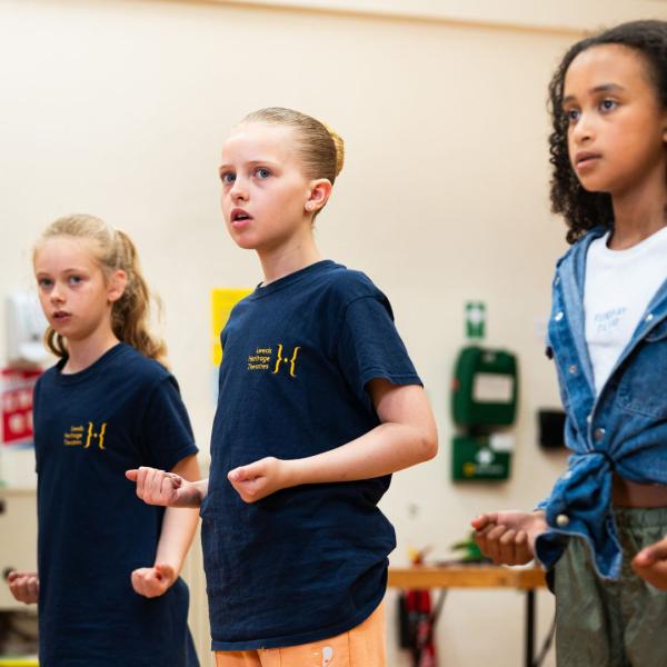 Three young girls in the rehearsal studio in Leeds Grand Theatre.