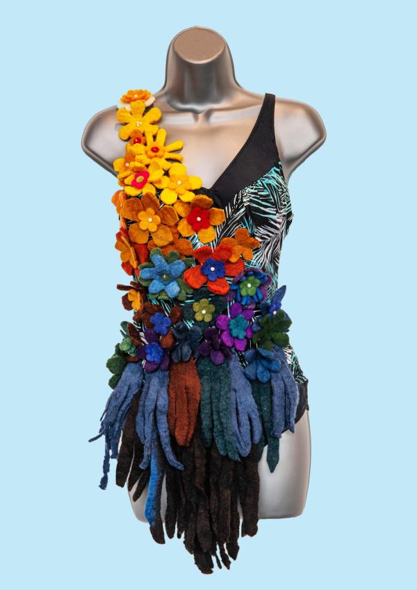 Beautiful swimming costume decorated with crafted and colourful flowers and tassels 