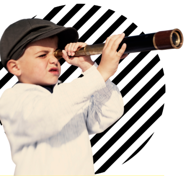 A photo of a boy in a flat cap looking through a telescope infront of a black and white background