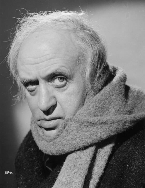 A black and white photograph from Scrooge featuring the titular character played by Alastair Sim.