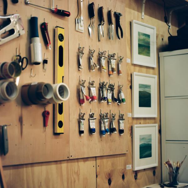 Tools and artwork on a wall