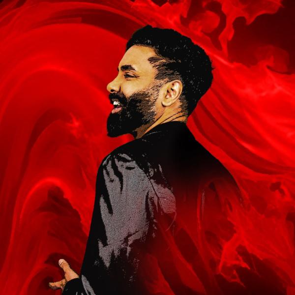 Side angle of an image Paul Chowdhry with a slight illustration filter on the image. He is stood amongst red wispy flames.