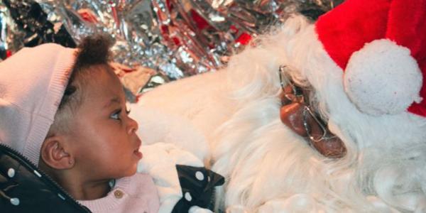 Cute baby with banta Clause