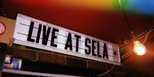 Retro sign reading LIVE AT SELA