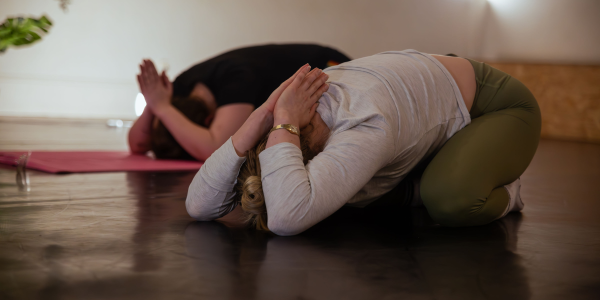 Two women doing pilates