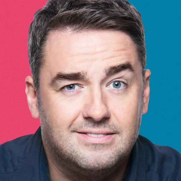 Headshot of Jason Manford raising his left eyebrow.