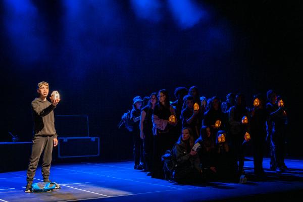 A group of young performers on stage