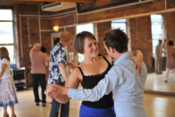 Two people in ballroom hold