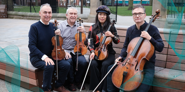 picture of four performers holding their instruments