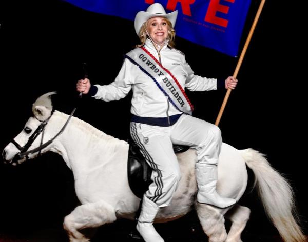 Hayley Ellis on a white horse, backwards