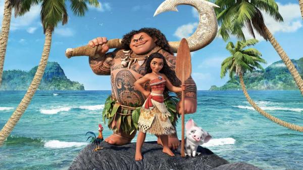 Maui and Moana stand together on a rock