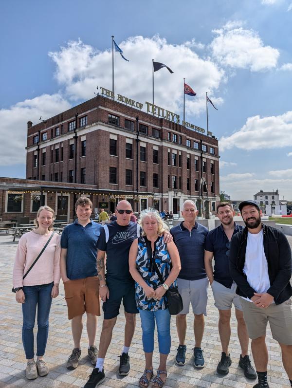 A group of people stood on the square outside The Tetley building