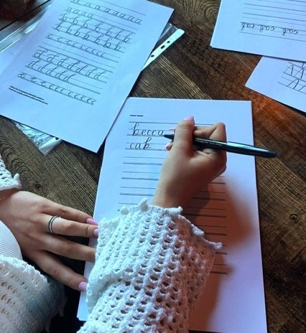 A close up shot of someone practising calligraphy.