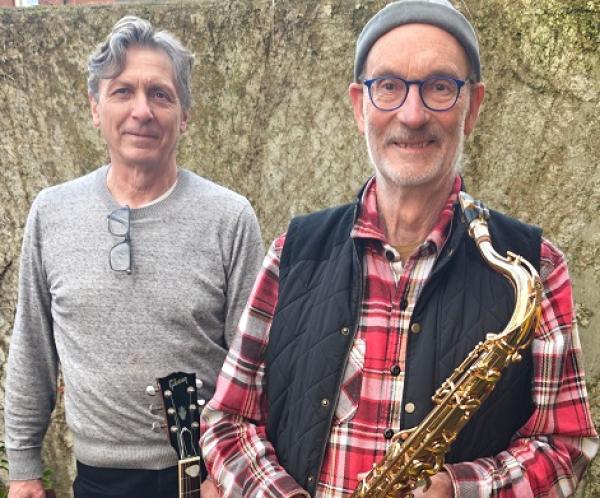 Richard Scott with saxophone, Martin Briggs with a guitar