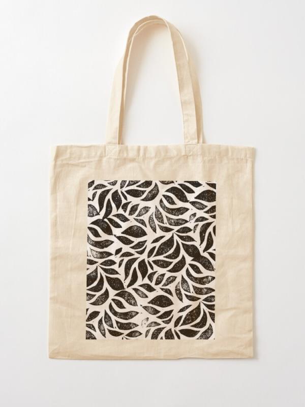 Tote bag with a pattern lino printed onto it.