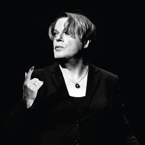 Black and white image of Eddie Izzard on stage during Hamlet.