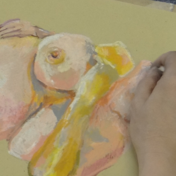 Life drawing sketch in yellow and pink pastel on yellow paper