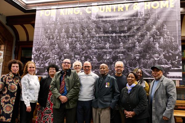 Alford Gardner (1926-2024), front centre wearing his medals, with veterans' relatives at the 2023 For King, Country & Home exhibition.