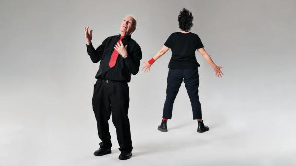 Two dancers from The Performace Ensemble dance on stage