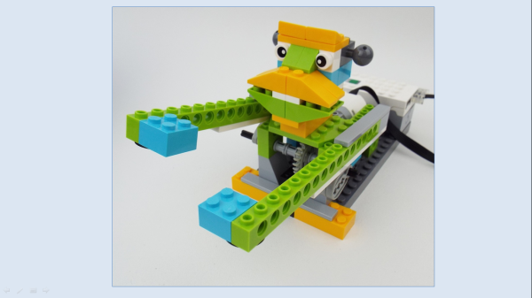 A monkey made out of brightly coloured lego blocks.