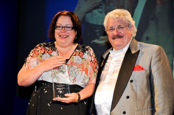 Picture of Lisa Holdsworth (with Bobby Knutt) winning the RTS Yorkshire Writer of the Year (2011).
