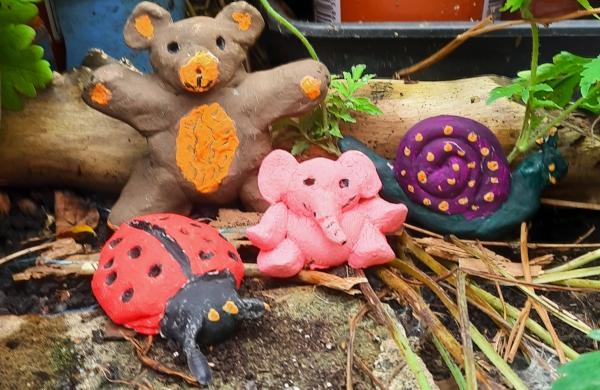 A ladybird, bear, elephant and snail made out of brightly coloured salt dough.